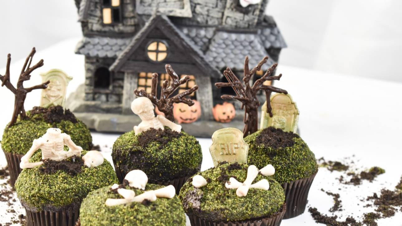 Graveyard themed cupcakes with chocolate dirt and skeleton decorations